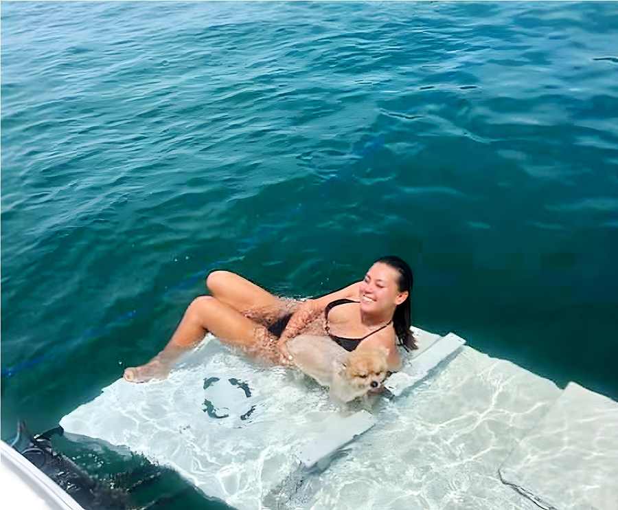 Swim platform lowered into clear water